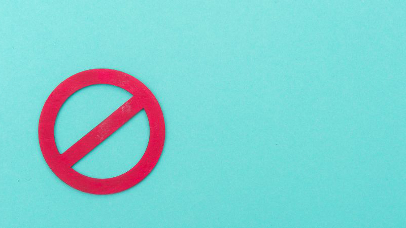 Ban sign in blue-green background